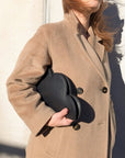 Elegant Chrome Leather Clutch – Stylish & Practical Essentials by Tairi Roosve at www.brixbailey.com