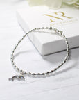 Sterling Silver Oval Bead Bracelet with Dolphin Charm