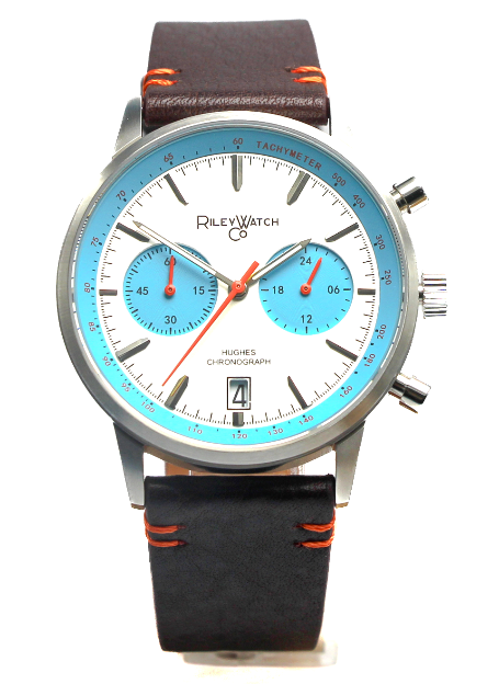 Wristwatch with a blue face and black leather strap on a white background at Brix + Bailey
