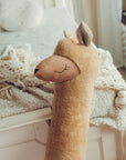 Handmade Giant Alpaca Toy Pillow in Rust - Eco-Friendly & Versatile Decor for Kids by Kai aš mažas buvau at www.brixbailey.com