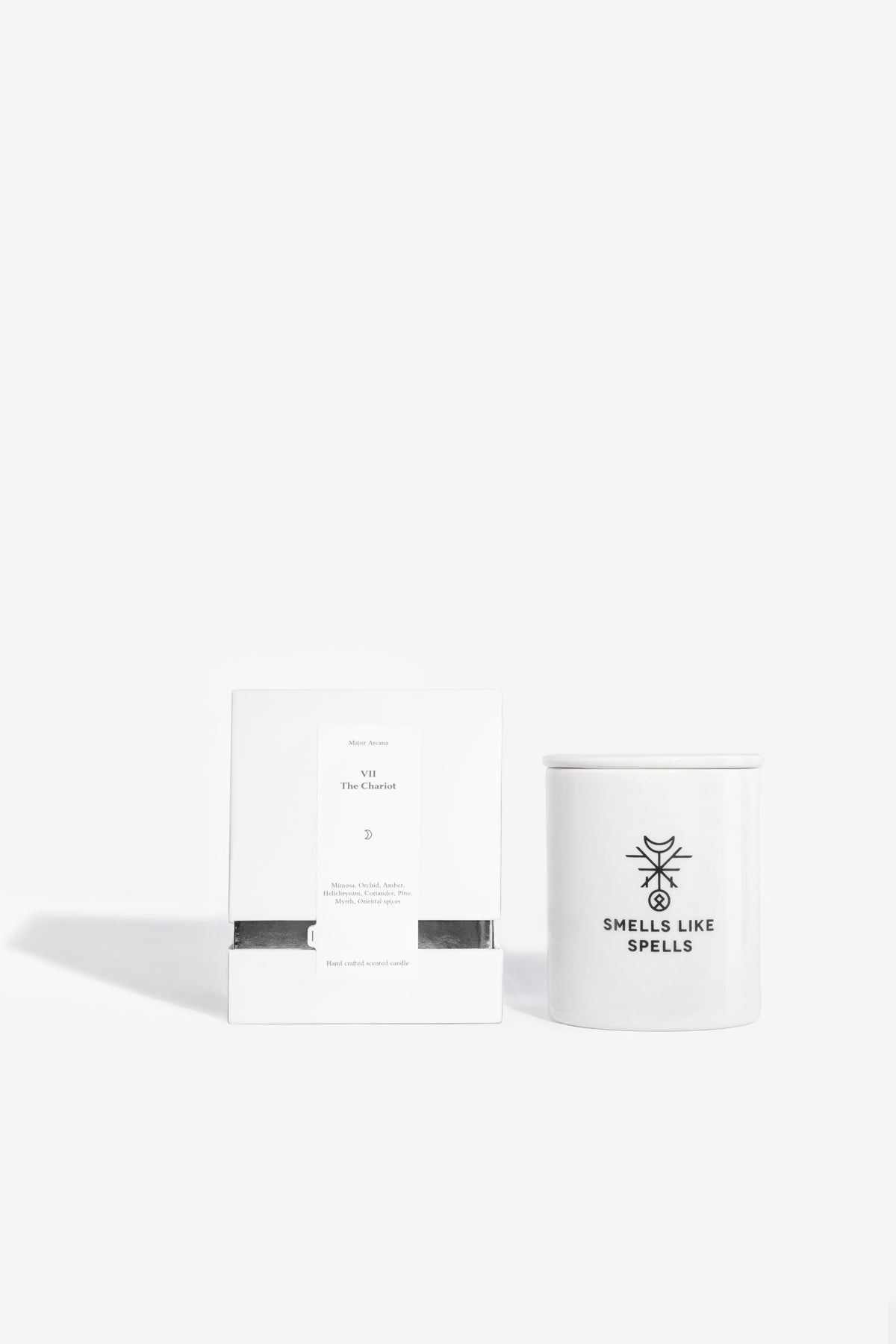 softly lit scented candle the chariot in handmade porcelain with a warm, comforting glow