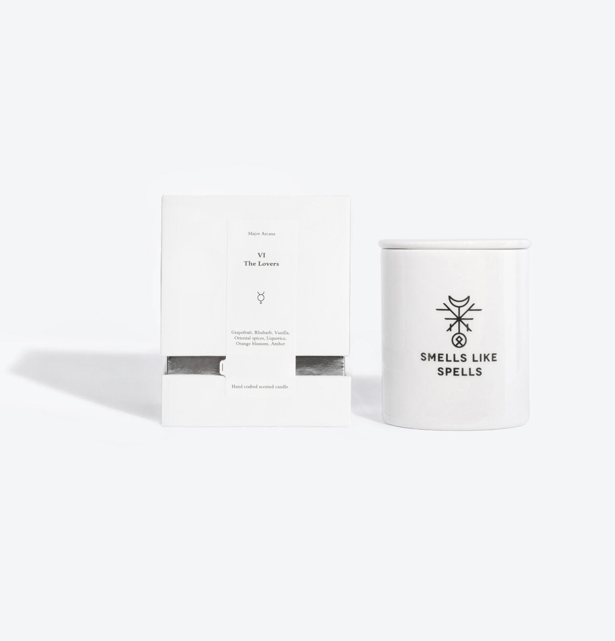 elegant porcelain lovers tarot candle glowing with a warm, inviting light on a sophisticated table