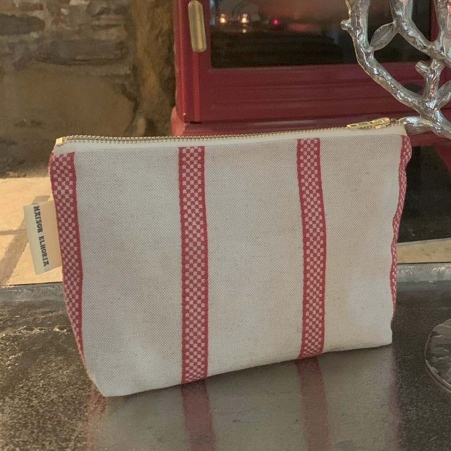Linen union toiletry bag with red stripes, compact travel organizer, stylish vintage design, durable zipper closure, best-selling gift for men and women by Maison Elhoria at brixbailey.com