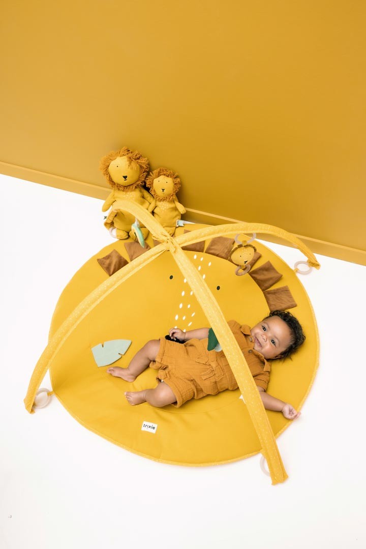 This exciting play mat, with its two arches and lots of fun activity toys, guarantees hours of play. It includes a teether, mirror, wooden rings, rattle, crinkle paper, fun fringes and flappy ears with different textures, ready to tickle all your child's senses. by Trixie Baby at www.brixbailey.com