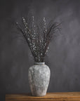 close-up of the textured stone finish on a tall ceramic vase, highlighting its practical 45cm height and rustic artisan craft