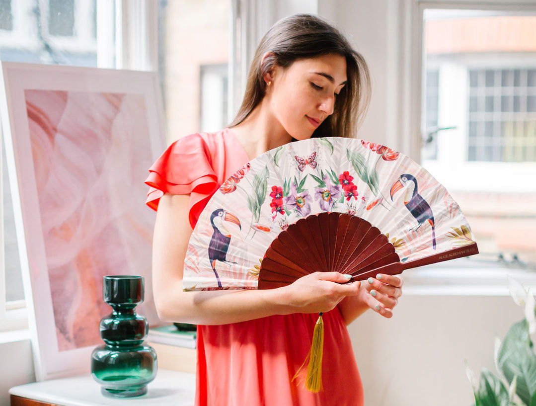 Floral Silk Fan with Toucan design and luxurious Gold tassel, part of the Mysa Collection