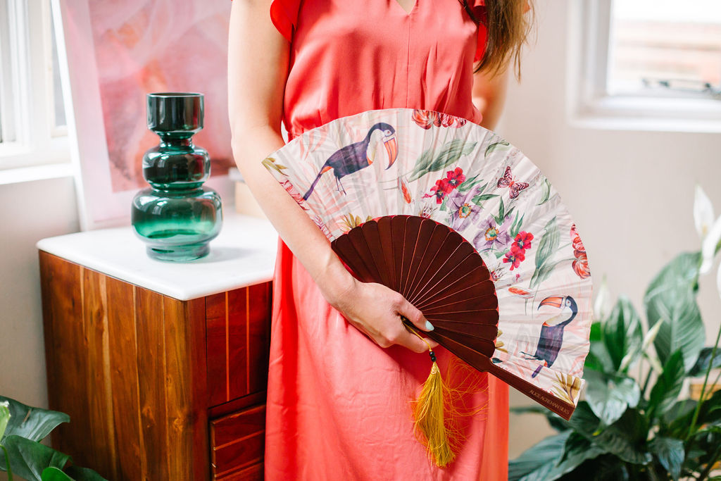 Floral Silk Fan with Toucan design and luxurious Gold tassel, part of the Mysa Collection