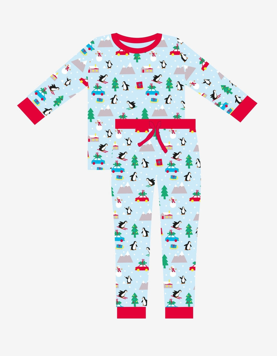Premium Christmas pajama set for couples, cozy organic cotton sleepwear with penguin and snowman print, luxury matching holiday loungewear by Toby Tiger at brixbailey.com