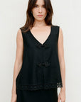 The Marie Sleeveless Wool Vest in black with lace trim