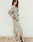 The Lena Wide-Leg Wool Trousers with side slit in beige