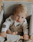 Discover Comfort and Sustainability with the Bouclé Cloth Baby Swing by Nofi KIDS at www.brixbailey.com