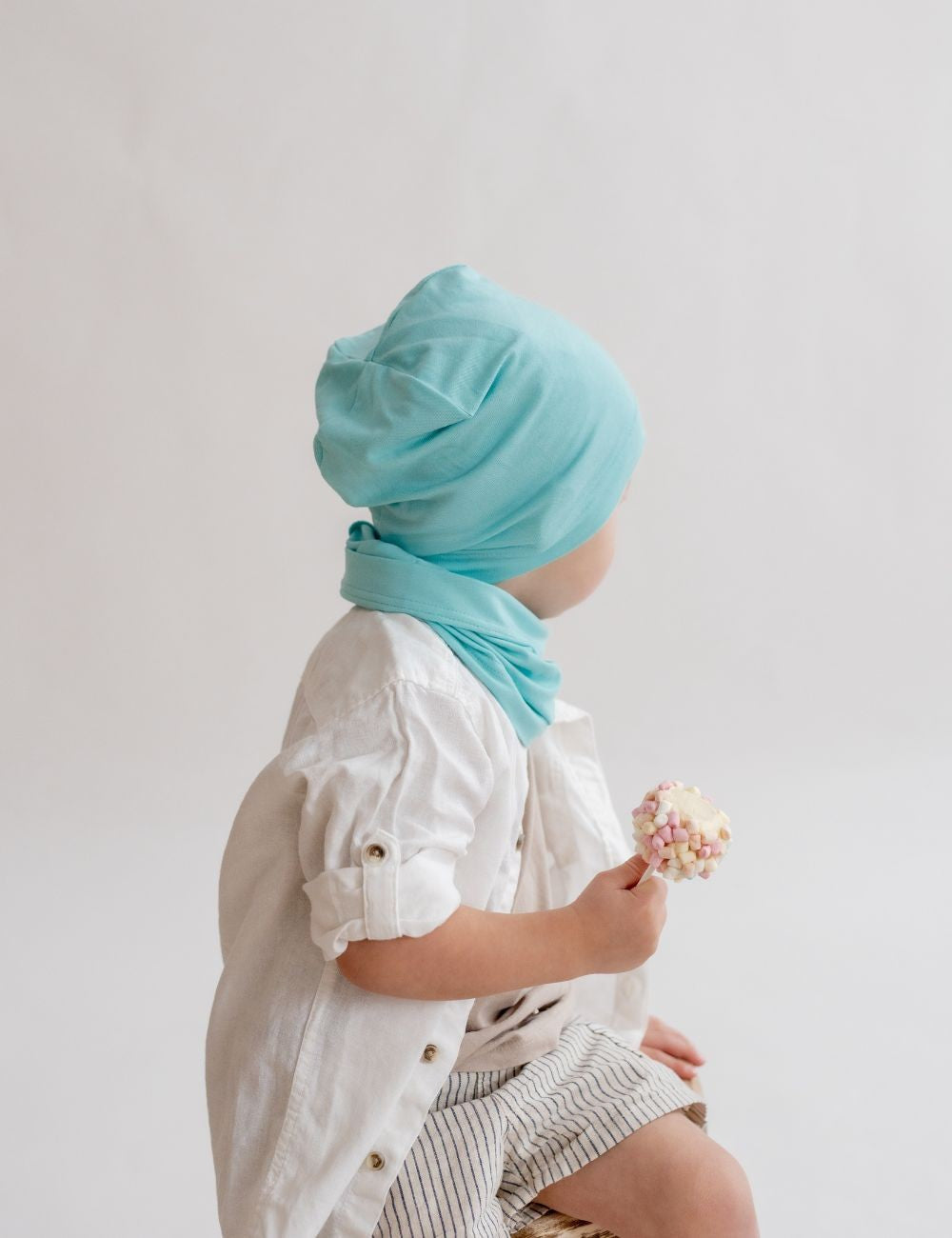 a child wearing a soft bamboo beanie in gentle morning light