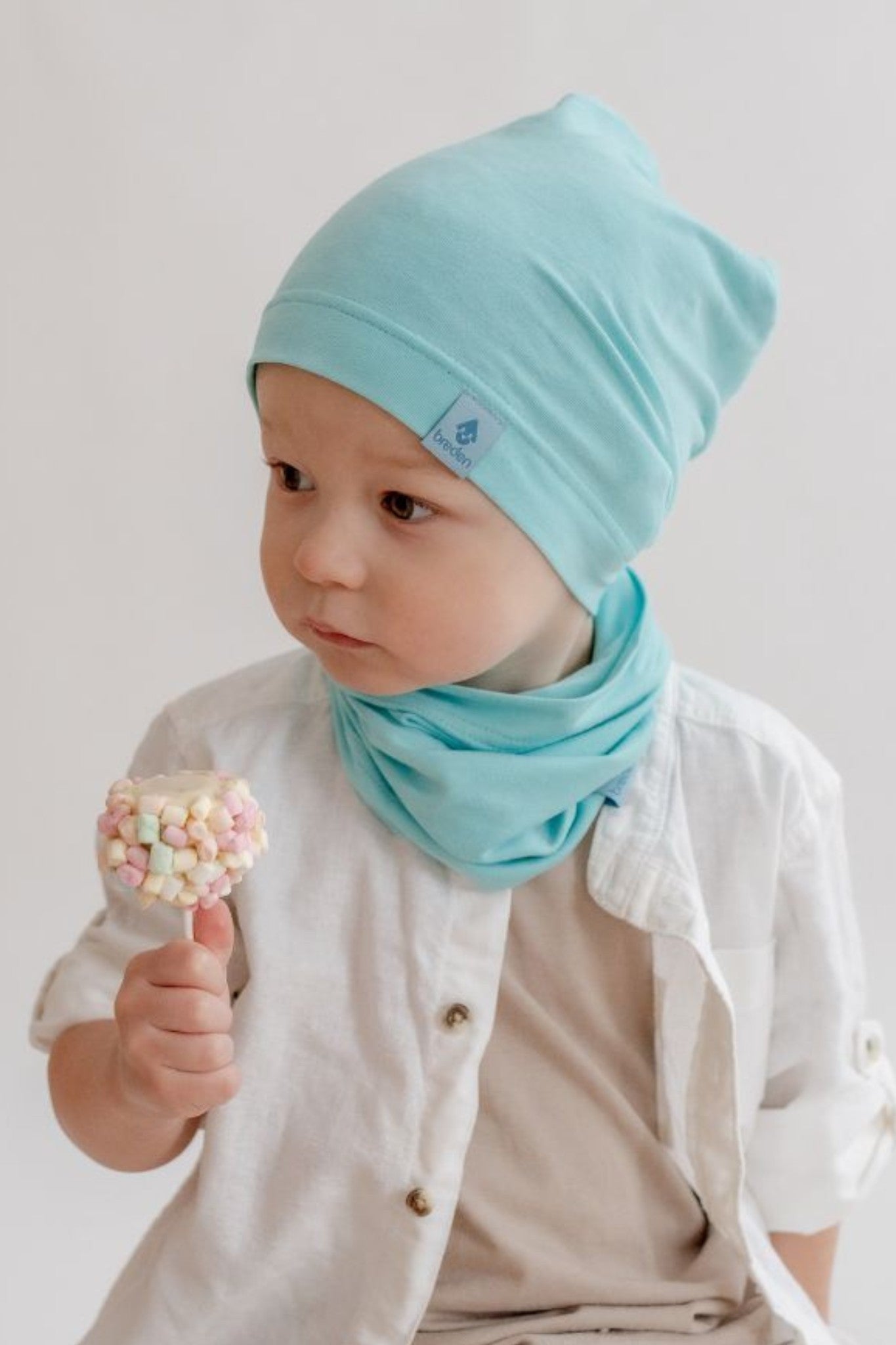bold close-up of the pablo kids beanie in bright sun, showcasing its lightweight bamboo fabric and sleek design