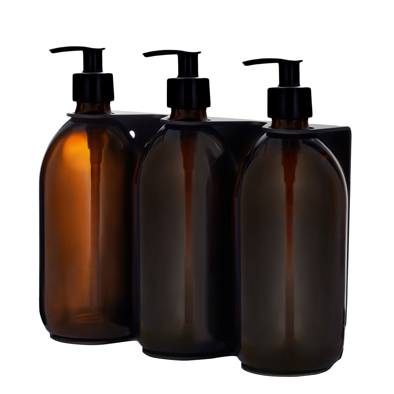Three Kuishi amber glass bottles with black pump dispensers on a white background