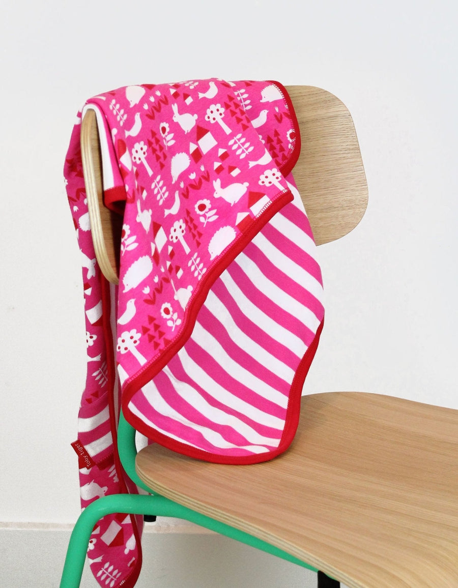 Premium organic baby blanket with pink garden print, soft 100% certified cotton, reversible design, stylish gift for newborns by Toby Tiger at brixbailey.com