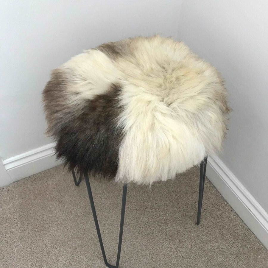 Luxury 35cm round sheepskin seat pad, premium British rare breed, sustainable eco-tanned, handcrafted natural melange, stylish home decor by Wildash London at brixbailey.com