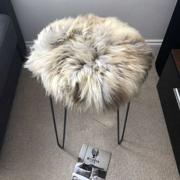 Premium 35cm round sheepskin seat pad, luxury British rare breed natural melange, handcrafted sustainable comfort, soft insulating breathable by Wildash London at brixbailey.com