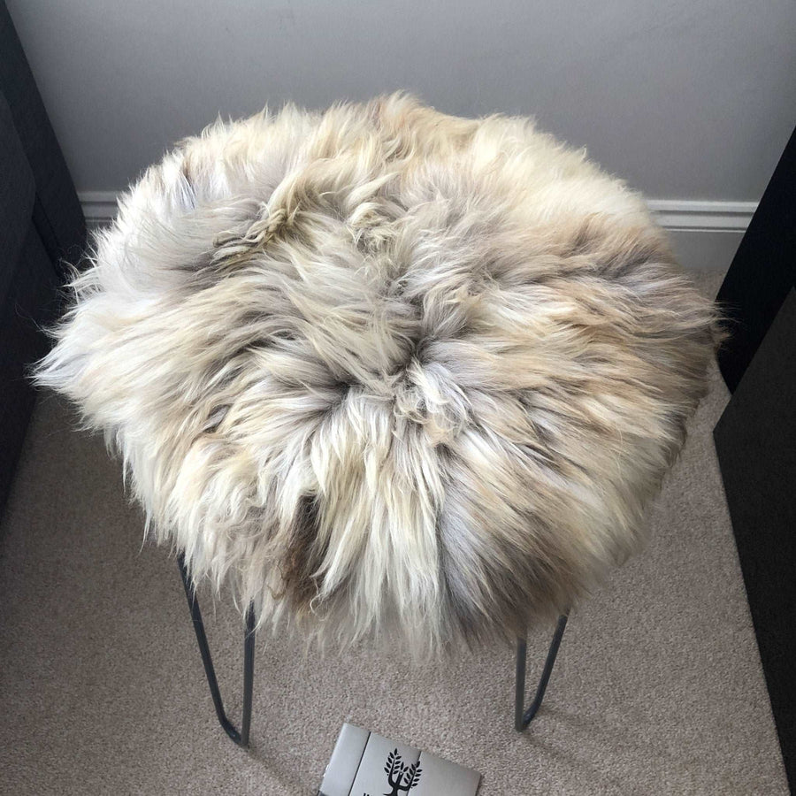 Premium 35cm round sheepskin seat pad, luxury British rare breed natural melange, handcrafted sustainable comfort, stylish home decor by Wildash London at brixbailey.com