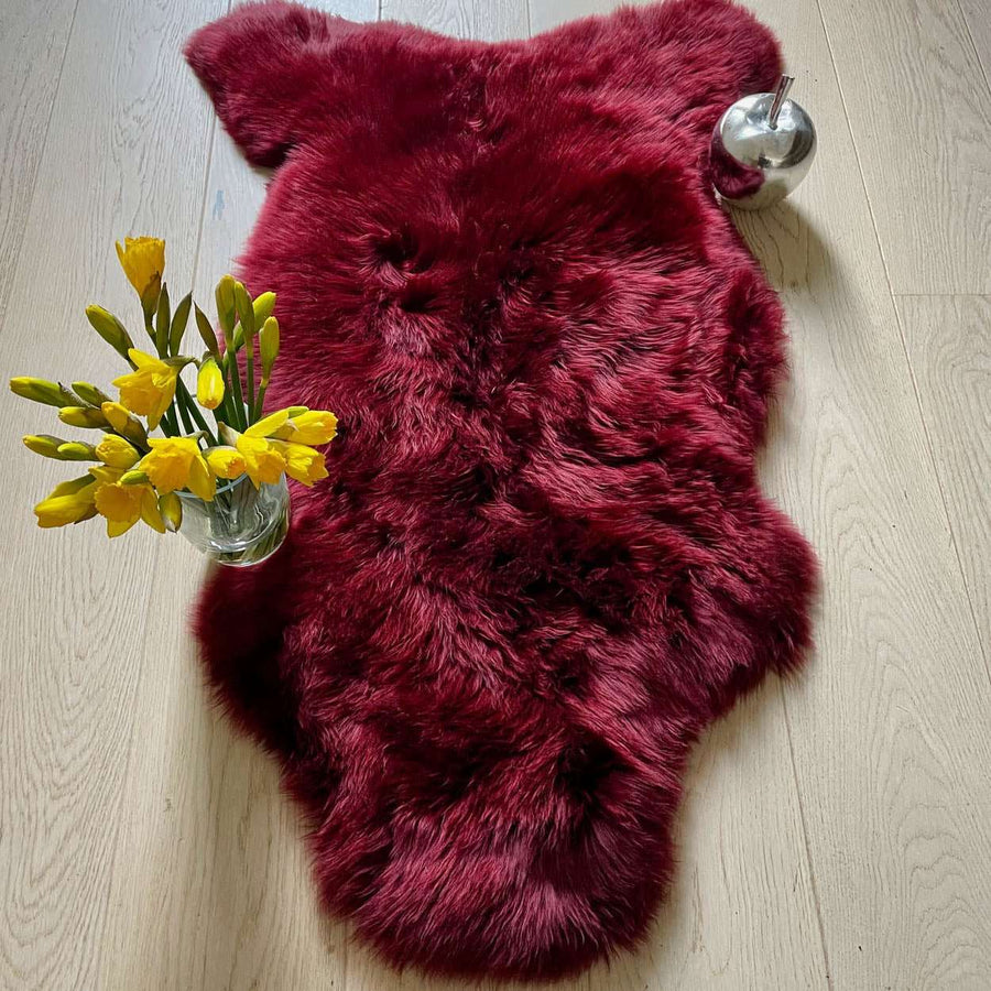 Premium British sheepskin rug, luxury Bordeaux red fleece throw, large ethically sourced organic sheepskin, soft hypoallergenic sustainable fur by Wildash London at brixbailey.com