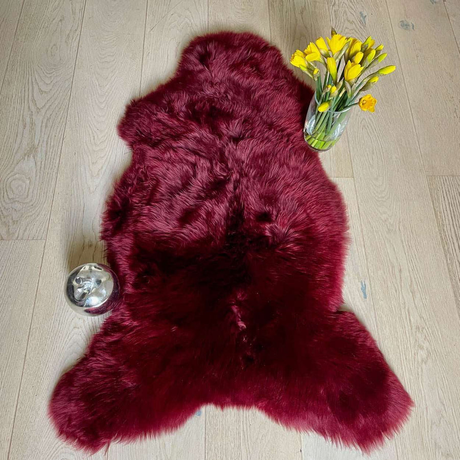 Premium British sheepskin rug, luxury Bordeaux red fleece throw, large ethically sourced handcrafted sheepskin, soft hypoallergenic organic fur by Wildash London at brixbailey.com