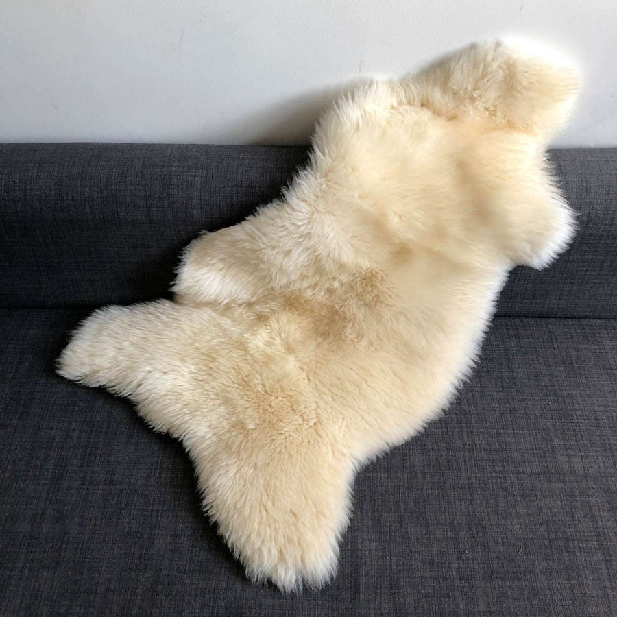 Luxury premium white sheepskin rug, super soft long fur, handcrafted natural ivory fleece, medium size throw, machine washable by Wildash London at brixbailey.com
