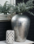 Hand-hammered silver ceramic vase with reflective metallic finish, modern home decor statement piece by sostter at brixbailey.com