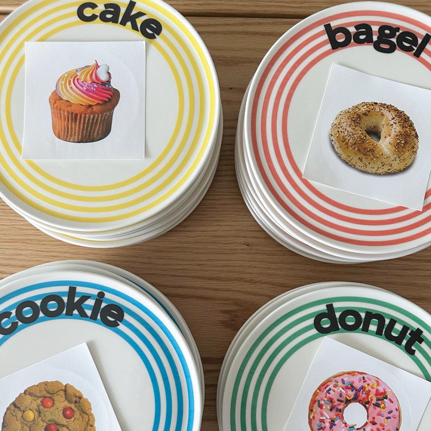Striped plates labelled cake, bagel, cookie and donut, from independent brands at Brix + Bailey.