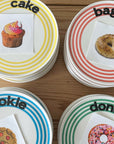 Striped plates labelled cake, bagel, cookie and donut, from independent brands at Brix + Bailey.
