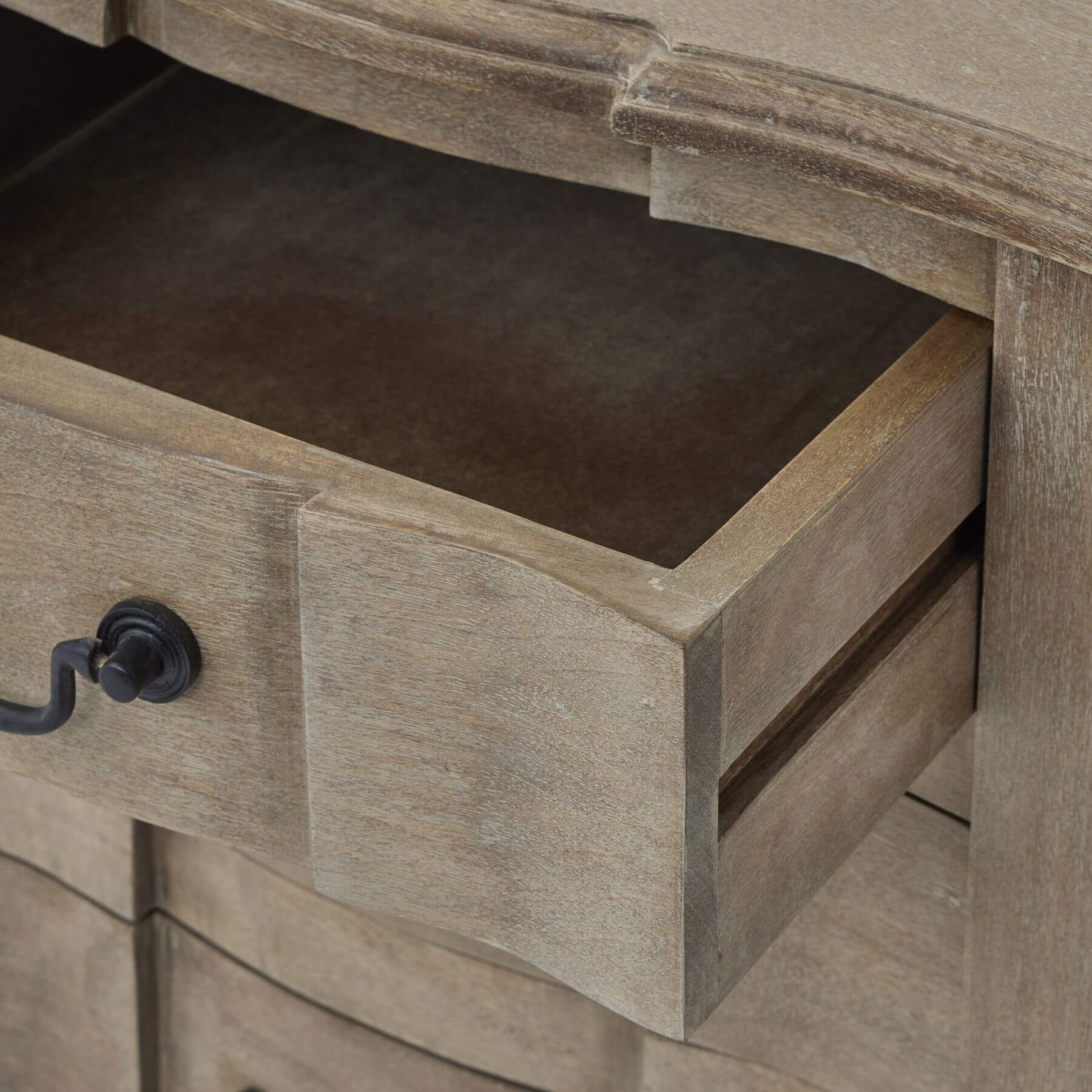 French-inspired hardwood chest of drawers with black iron handles and bleached wood finish, six spacious drawers. by Sostter at brixbailey.com