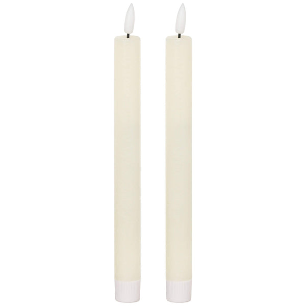 Elegant ivory LED dinner candle with warm flickering glow, flameless and smokeless, 25cm tall for stylish table decor by Sostter at brixbailey.com