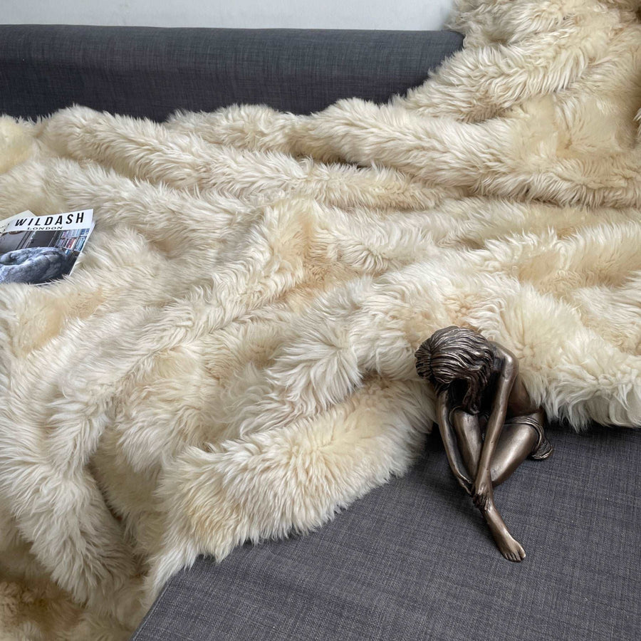 Luxury champagne Tuscan shearling throw rug, ultra-dense and super soft, handcrafted premium fur for bed or sofa, best-selling unique piece by Wildash London at brixbailey.com