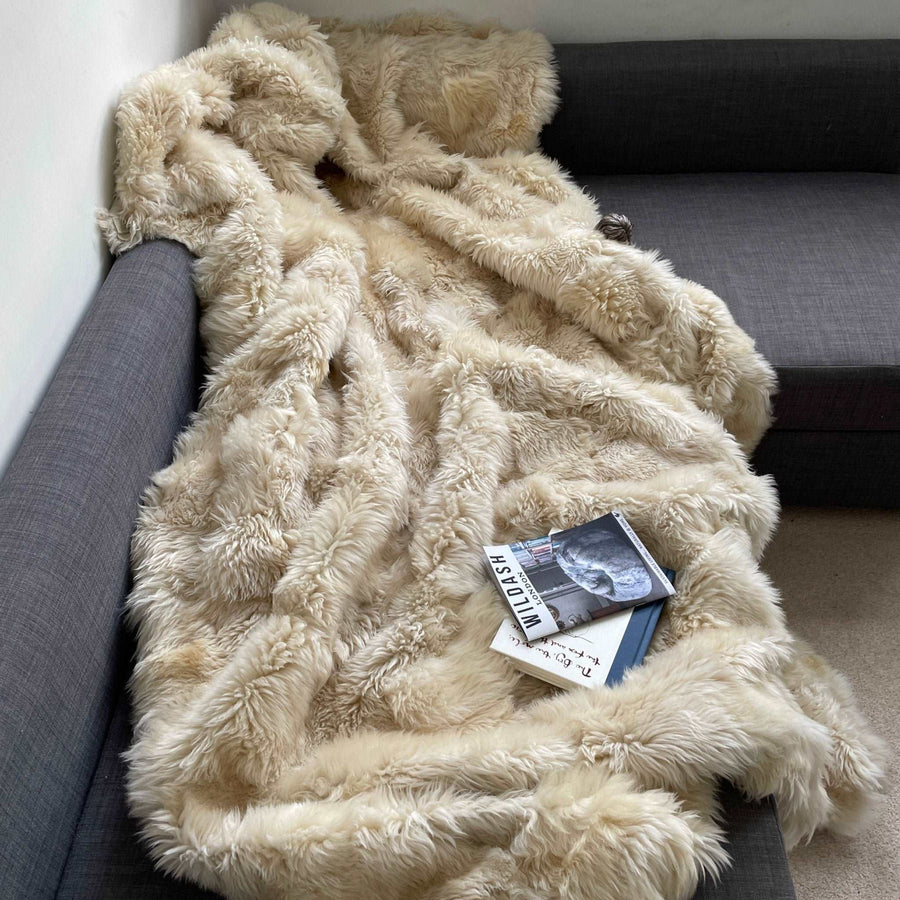 Luxury champagne Tuscan shearling throw rug, ultra-dense soft fur, premium handcrafted heirloom piece, stylish bed or sofa decor by Wildash London at brixbailey.com
