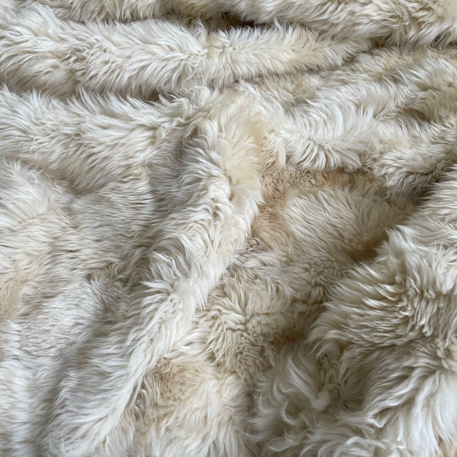 Luxury champagne Tuscan shearling throw rug, ultra-dense soft fur, premium handcrafted heirloom piece, best-selling stylish home decor by Wildash London at brixbailey.com