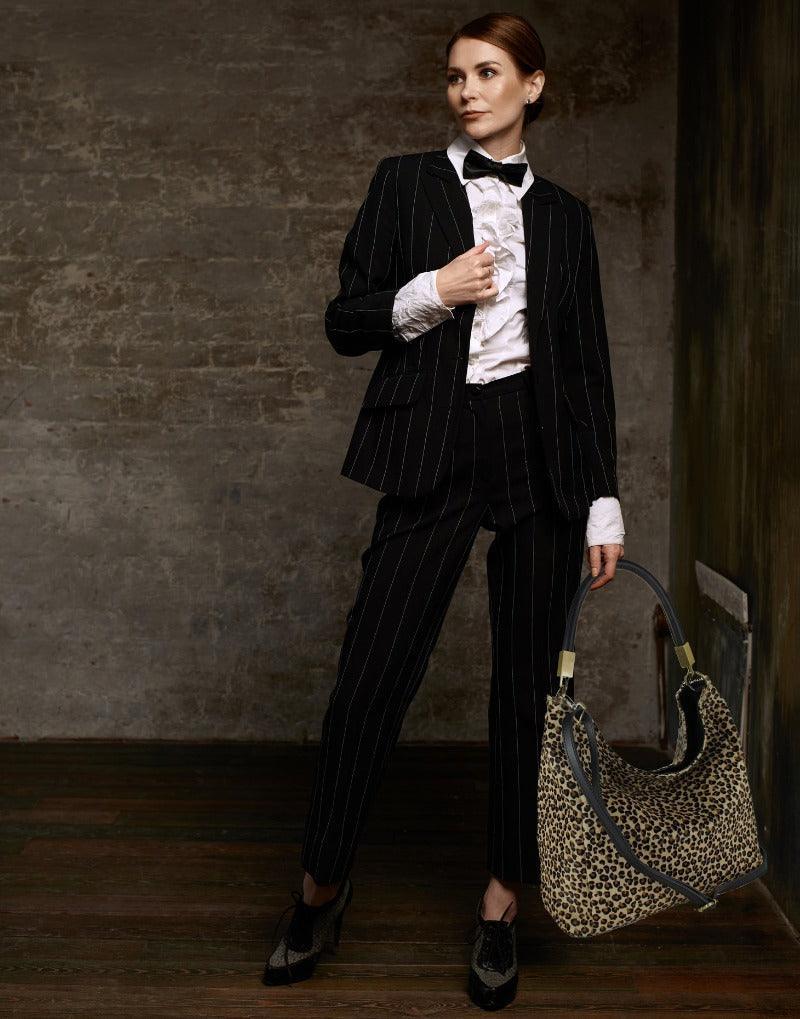 Cheetah Print Leather Tassel Grab Bag – Versatile & Elegant by Sostter at brixbailey.com