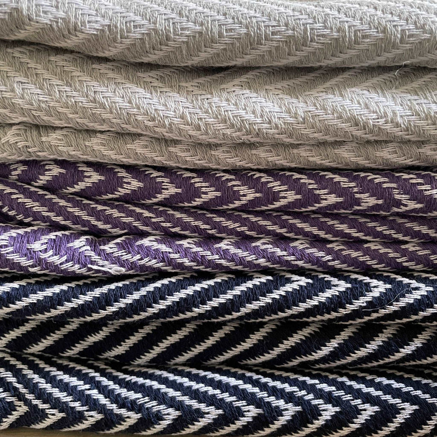 Luxury deep purple chevron organic cotton throw, premium handloomed oversized blanket, stylish bold zigzag pattern, soft heavy weight for bed or sofa by Wildash London at brixbailey.com
