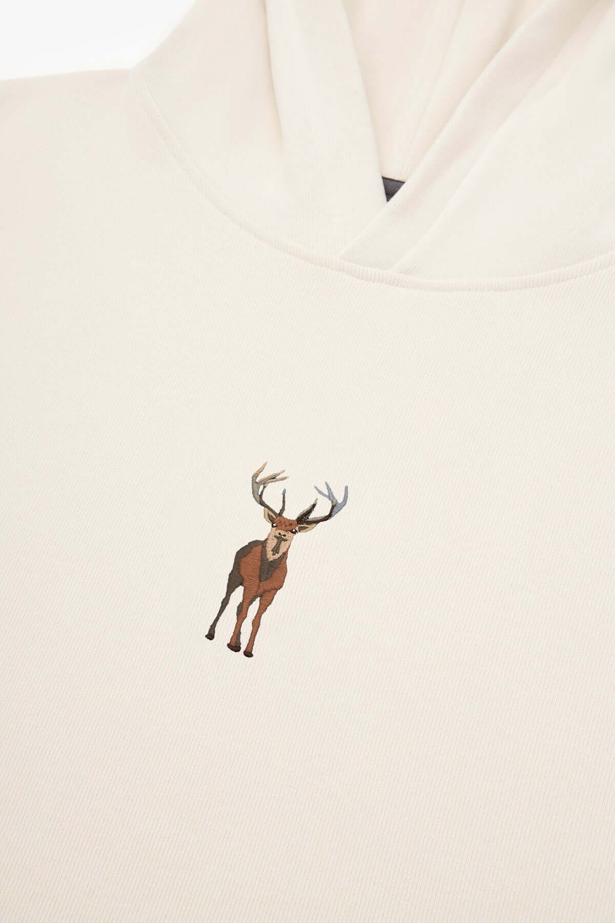 Unisex Cream Hoodie with Embroidered Deer
