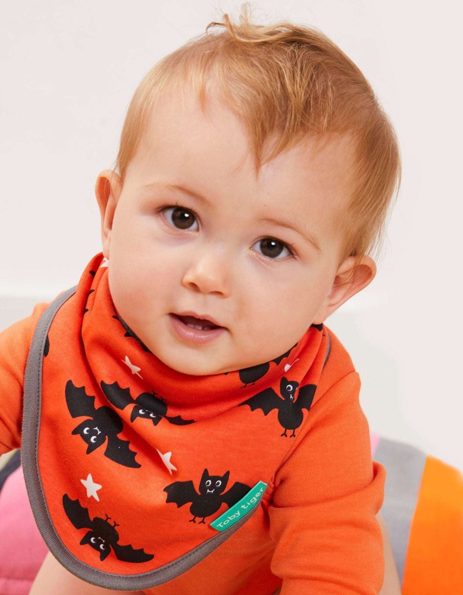 Premium organic baby bandana bib, super soft 100% GOTS certified cotton, adjustable snap closure, stylish bat print, eco-friendly dyes, machine washable by Toby Tiger at brixbailey.com