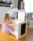 bold front view of the wooden 2-in-1 diner playset in a bright, sunlit playroom