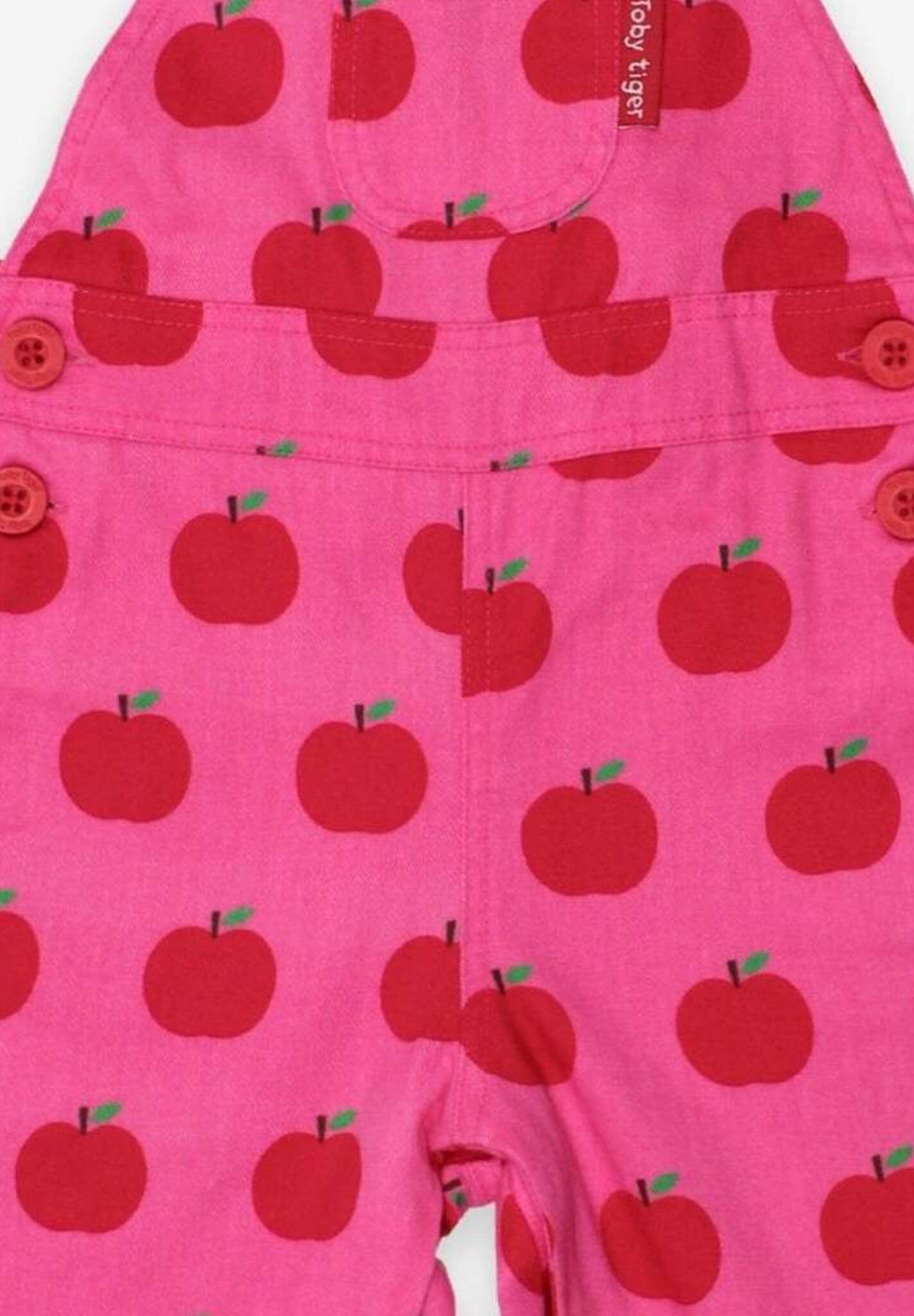 Premium organic apple print twill overalls, soft adjustable baby romper with snap buttons, stylish unisex crawler pants by Toby Tiger at brixbailey.com