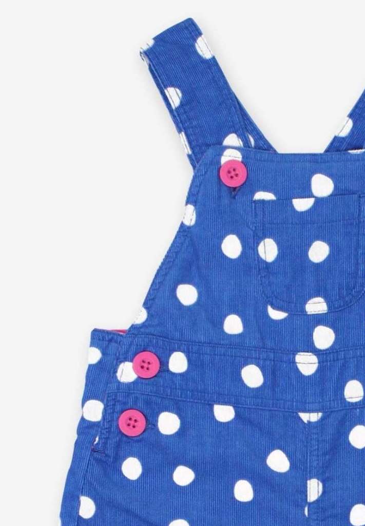 Premium organic cotton pinafore overall in blue with white polka dots, stylish and comfortable, adjustable straps for growing kids, soft jersey lining by Toby Tiger at brixbailey.com