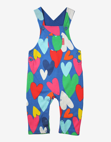 Premium Toby Tiger kids denim overalls with multicolor heart print, adjustable straps, soft organic cotton, machine washable by Toby Tiger at brixbailey.com