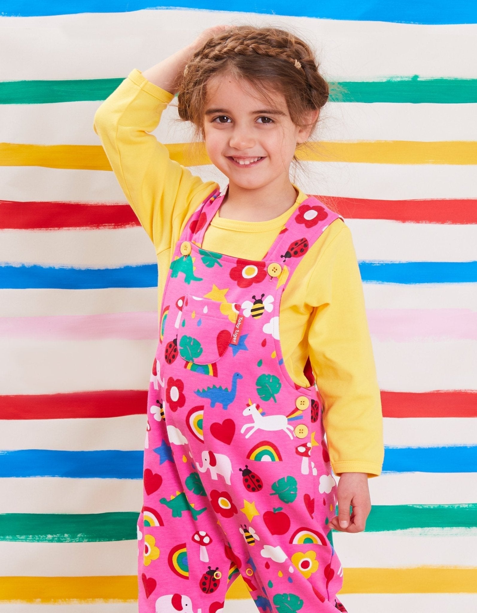 Premium organic cotton baby overall with toy print, adjustable straps, GOTS certified, stylish and sustainable Toby Tiger design by Toby Tiger at brixbailey.com