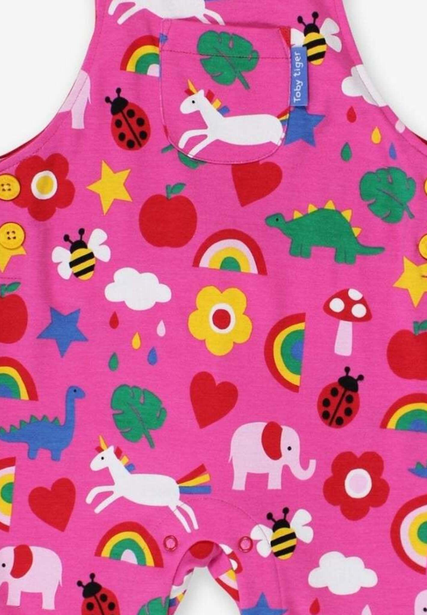 Premium organic cotton baby overalls with toy print, adjustable straps and buttons, GOTS certified, sustainable, stylish Toby Tiger design by Toby Tiger at brixbailey.com