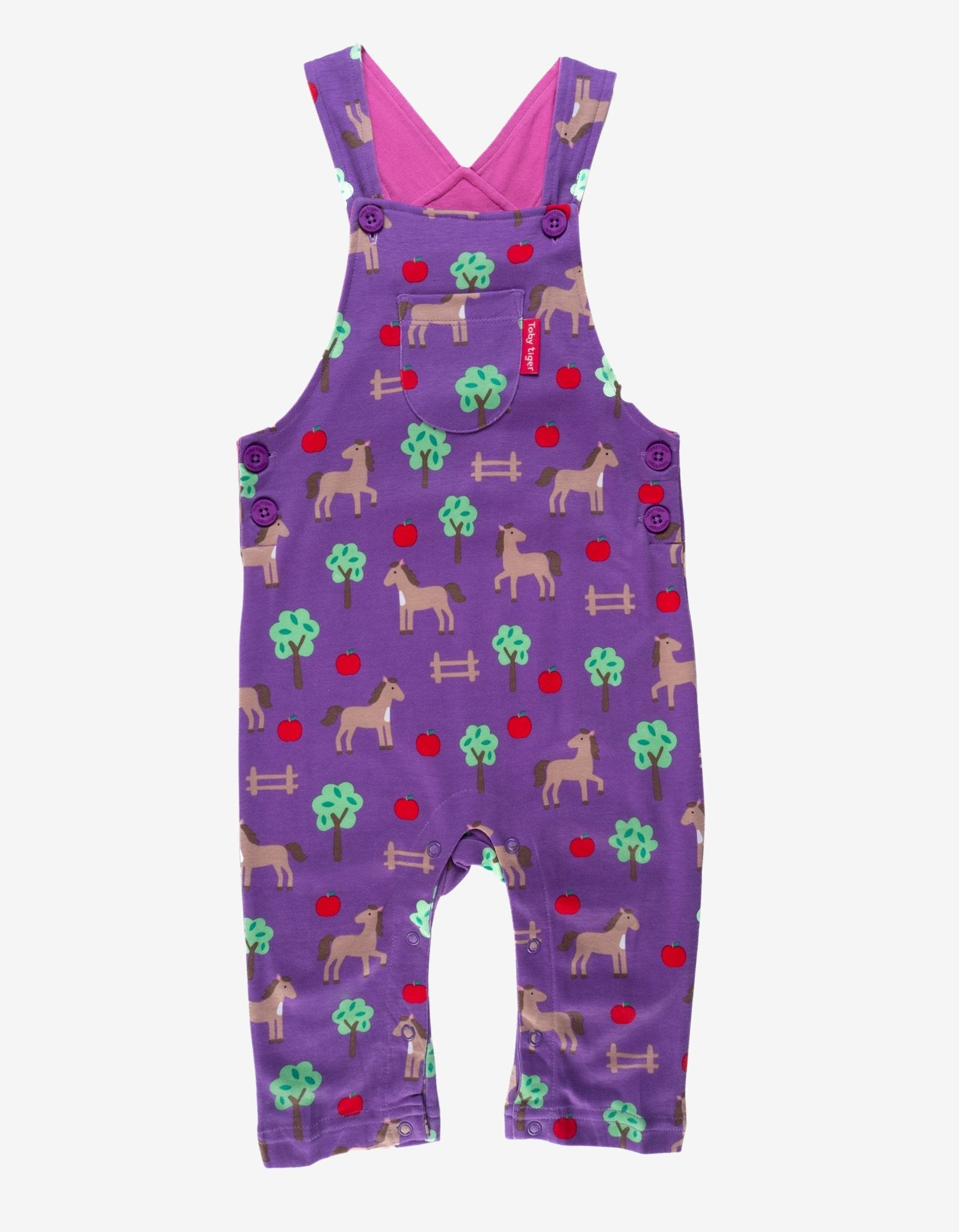 Premium organic cotton baby overalls with dreamy horse and apple print, adjustable straps, snap buttons, soft GOTS-certified fabric by Toby Tiger at brixbailey.com