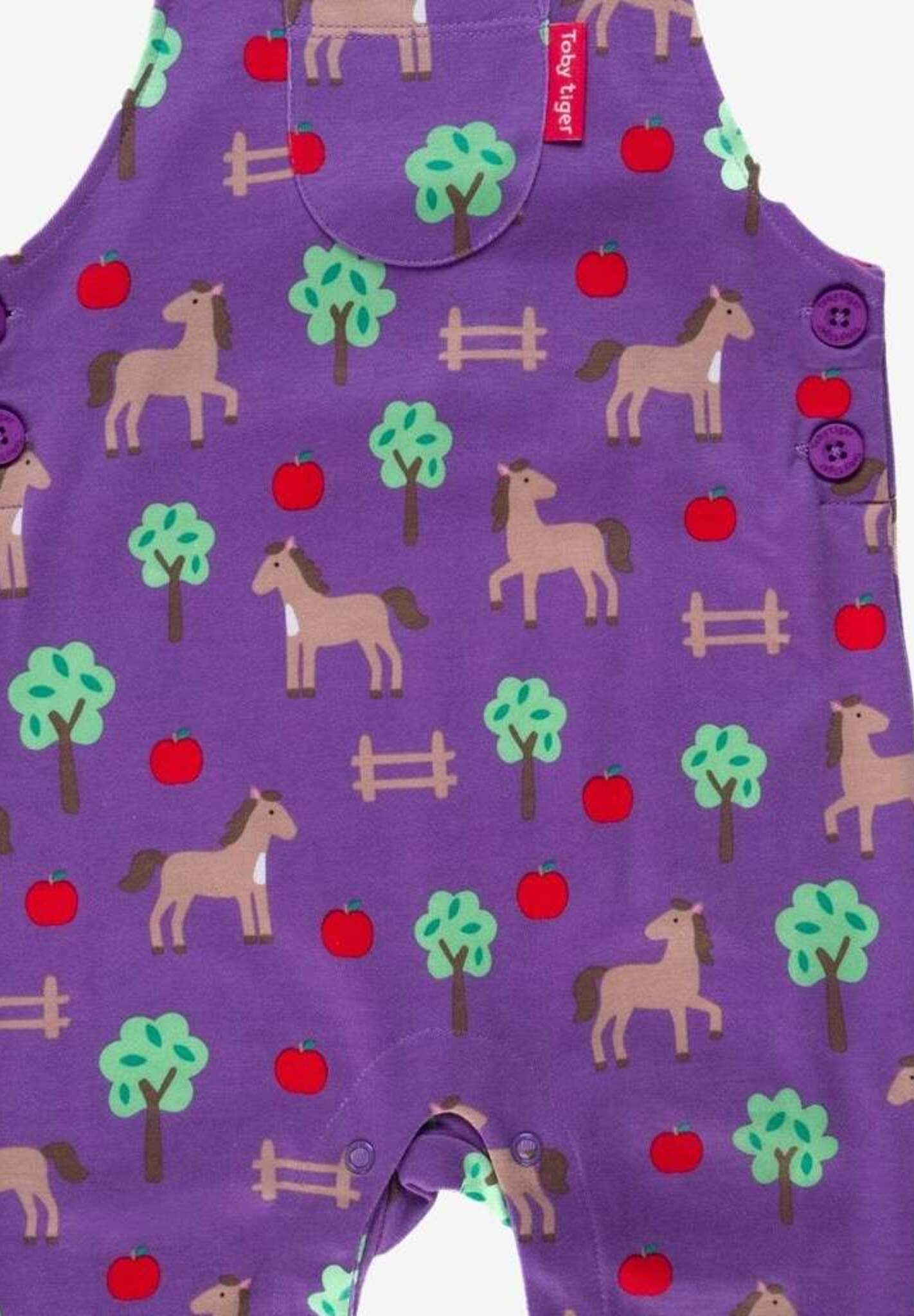 Premium organic cotton baby overall with soft horse and apple print, adjustable straps, snap buttons, GOTS certified by Toby Tiger at brixbailey.com