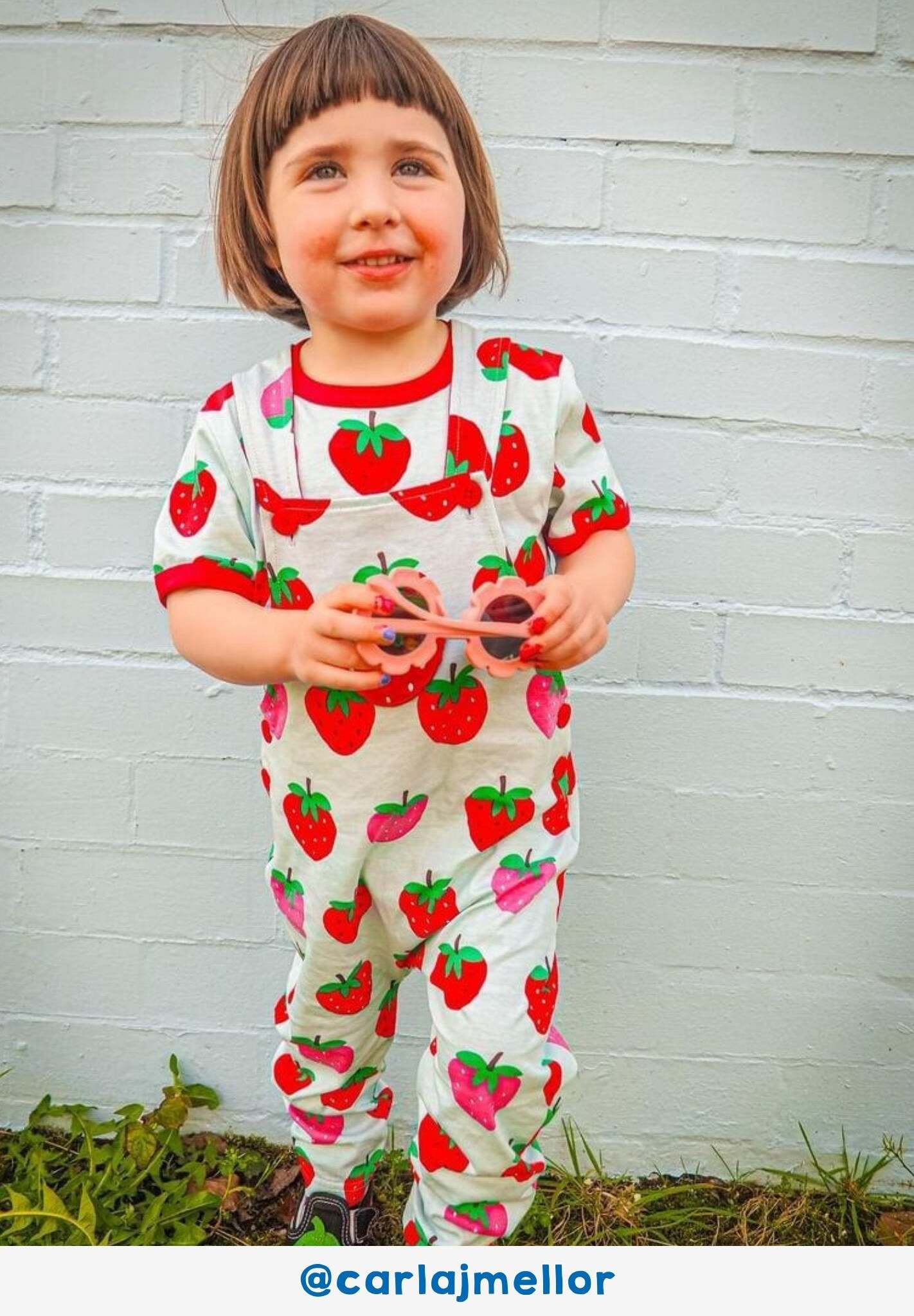 Premium baby denim overall with organic strawberry print, adjustable straps, snap buttons, Toby Tiger design, GOTS certified cotton by Toby Tiger at brixbailey.com