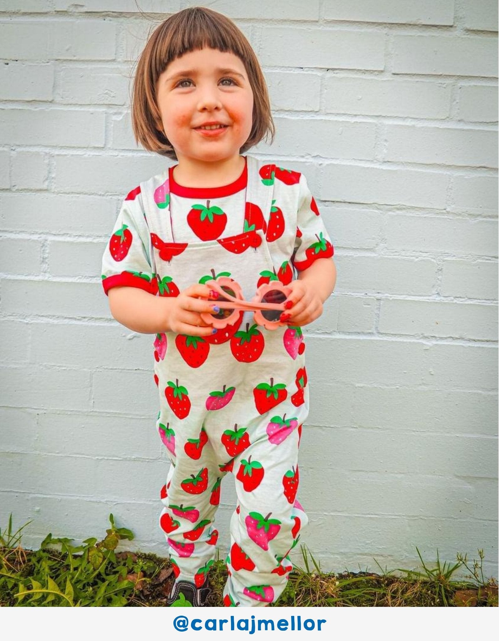 Luxury baby blue organic cotton strawberry print dungarees, adjustable straps, snap buttons, premium Toby Tiger design, best-selling by Toby Tiger at brixbailey.com