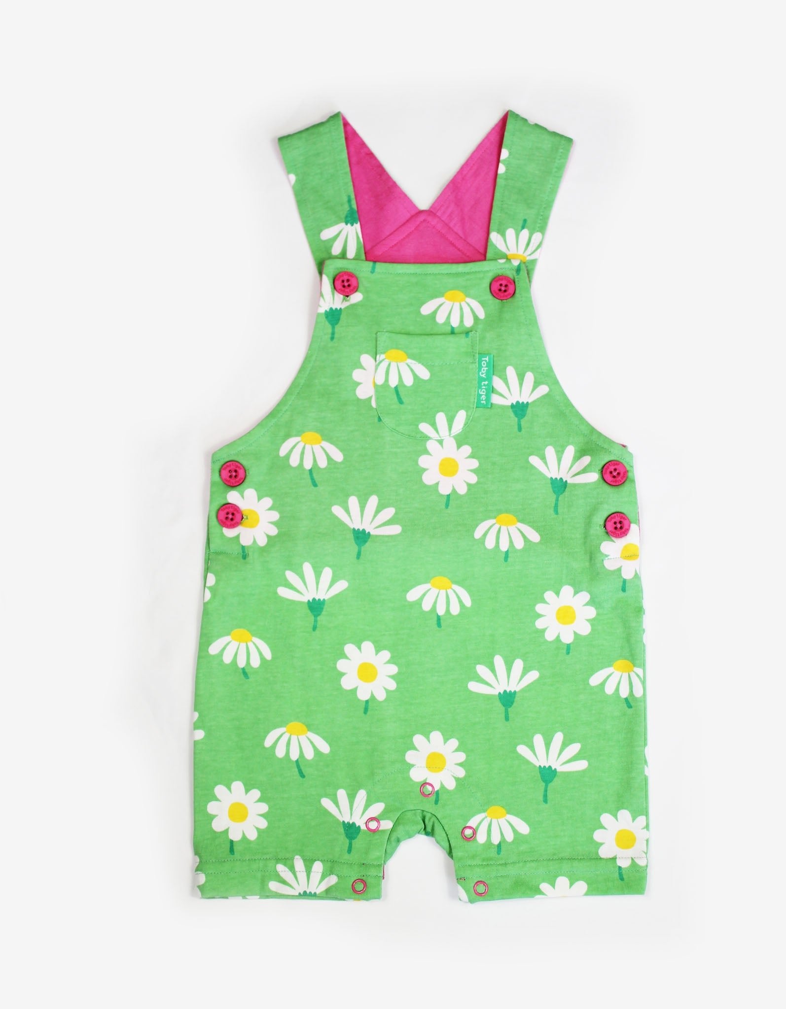 Luxury summer dungaree shorts with daisy print, premium organic cotton, adjustable straps, snap buttons, stylish floral kids romper by Toby Tiger at brixbailey.com