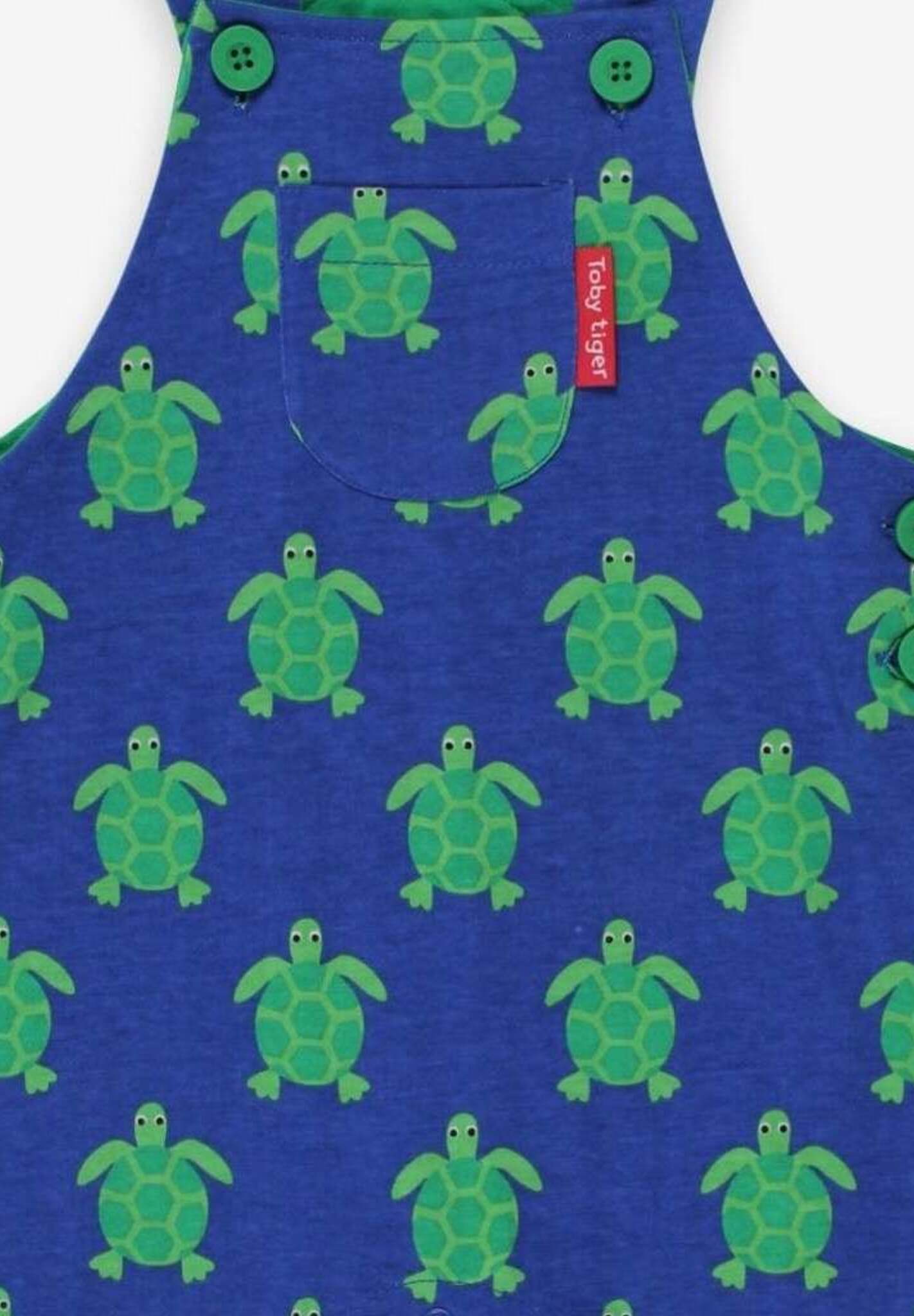 Premium baby overall with turtle print in green and blue, adjustable straps, snap buttons, soft GOTS certified organic cotton by Toby Tiger at brixbailey.com
