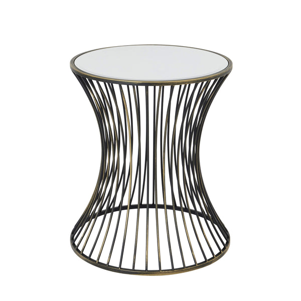 Handcrafted brass side table with black patina finish, concave silhouette, and mirrored glass surface for modern interiors. by Sostter at brixbailey.com